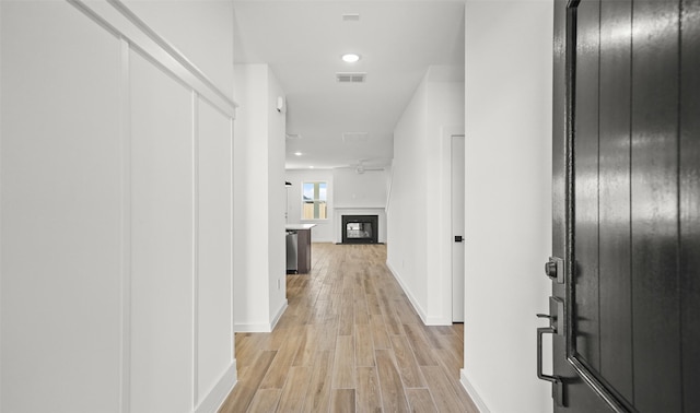 hall with light wood-type flooring