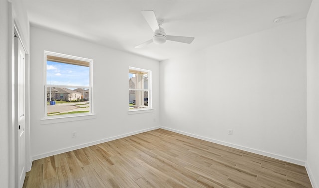 unfurnished room featuring light hardwood / wood-style floors and ceiling fan