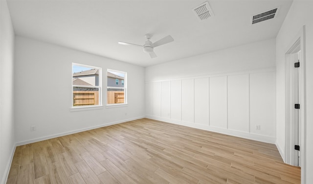 empty room featuring ceiling fan and light wood-type flooring