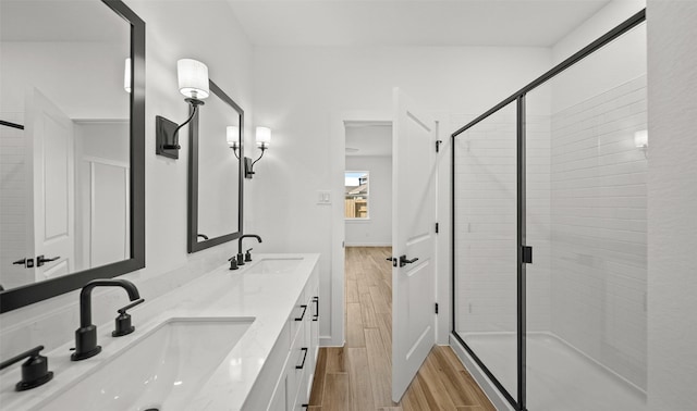 bathroom featuring vanity and an enclosed shower