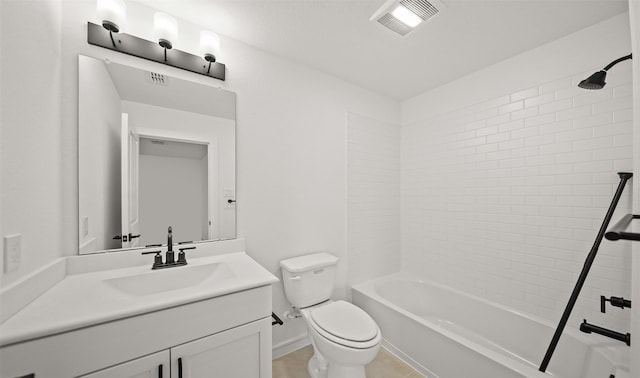 full bathroom with toilet, vanity, and tiled shower / bath