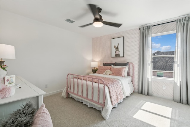 bedroom featuring ceiling fan and light carpet