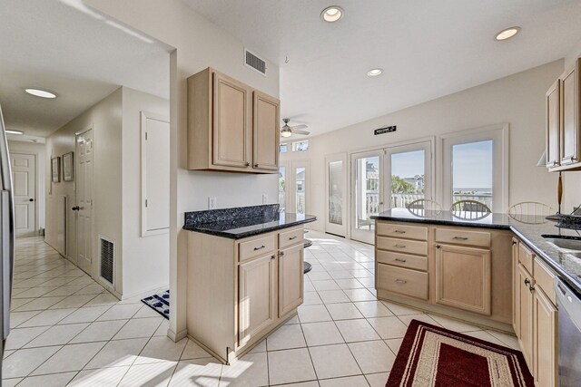 kitchen featuring ceiling fan, light brown cabinets, light tile patterned flooring, and french doors