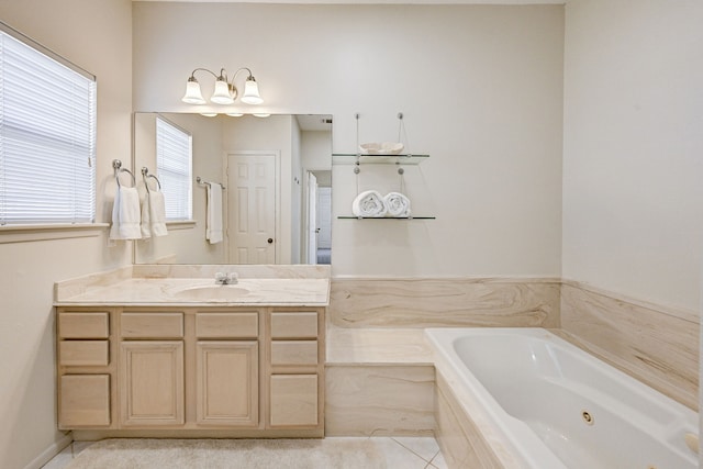 bathroom featuring vanity and tiled bath