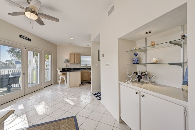 kitchen with ceiling fan, french doors, sink, light brown cabinets, and light tile patterned floors