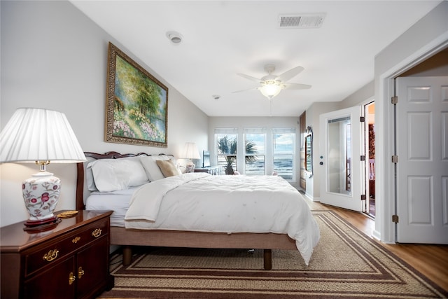 bedroom with hardwood / wood-style floors and ceiling fan