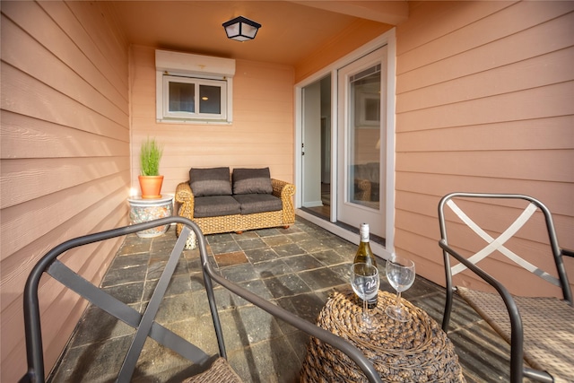 view of patio / terrace with a wall mounted air conditioner