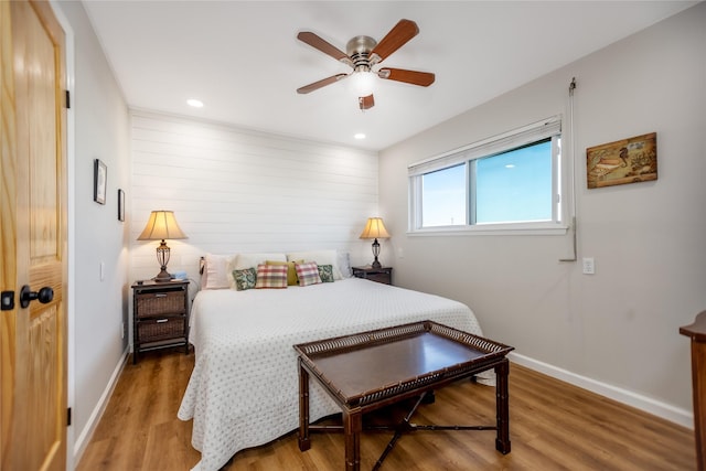 bedroom featuring ceiling fan and hardwood / wood-style floors