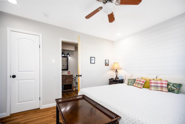 bedroom with hardwood / wood-style floors and ceiling fan