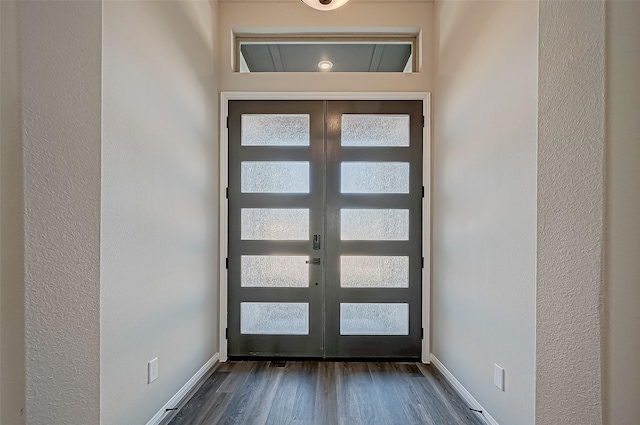 interior space with dark hardwood / wood-style flooring and french doors