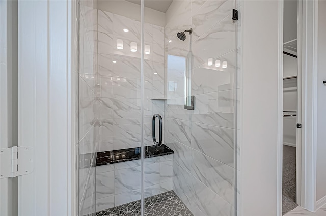 bathroom featuring an enclosed shower