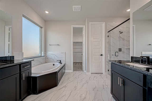 451 Papershell Path, Richmond, TX 77406 - bathroom with a stall shower, two vanities, marble finish flooring, a bath, and a walk in closet