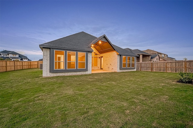 451 Papershell Path, Richmond, TX 77406 - back of property with brick siding, a fenced backyard, and a shingled roof