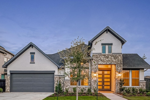 451 Papershell Path, Richmond, TX 77406 - view of front of property with stone siding, stucco siding, driveway, and roof with shingles