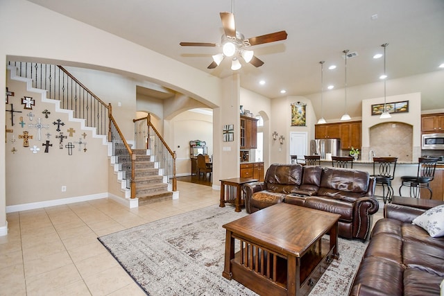 living room featuring ceiling fan and light tile patterned flooring