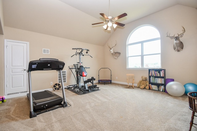 workout room with ceiling fan, lofted ceiling, and carpet floors