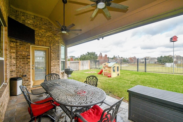 view of patio / terrace featuring a playground and ceiling fan