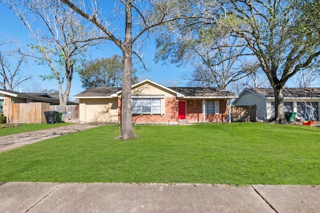 single story home with a garage and a front lawn