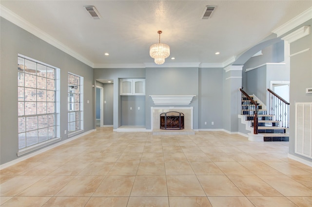 unfurnished living room with a notable chandelier, crown molding, light tile patterned floors, and a fireplace