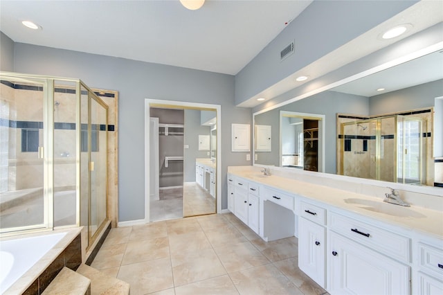 bathroom featuring vanity, tile patterned floors, and independent shower and bath