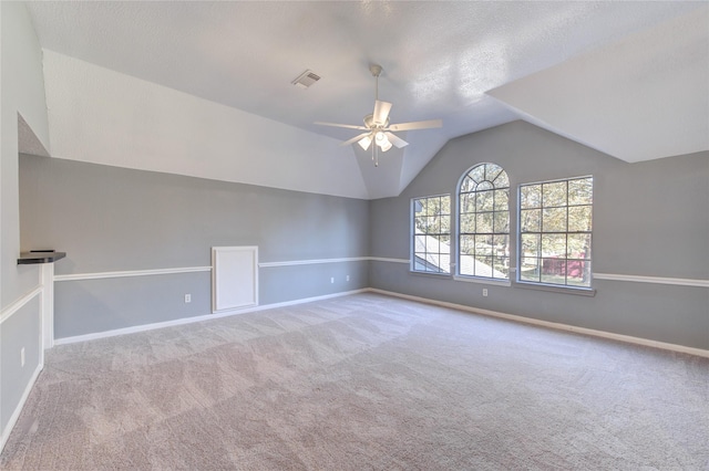 bonus room with ceiling fan, light colored carpet, and lofted ceiling