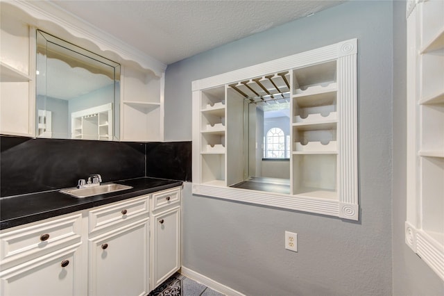 bathroom featuring vanity and a textured ceiling