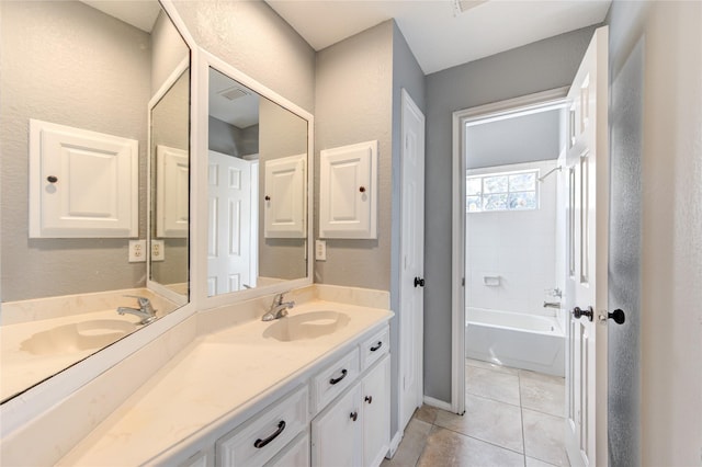 bathroom with tile patterned floors, vanity, and shower / bathtub combination