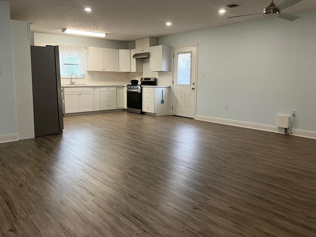 kitchen featuring white cabinetry, sink, dark wood-type flooring, a textured ceiling, and appliances with stainless steel finishes