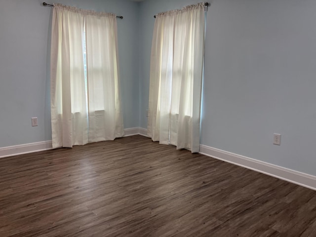 empty room featuring dark hardwood / wood-style floors