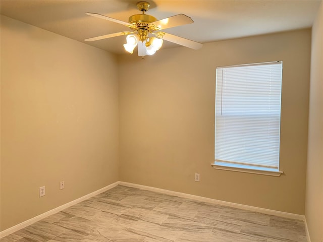 spare room with ceiling fan