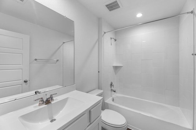 full bathroom featuring vanity, bathtub / shower combination, and toilet