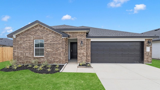 view of front facade featuring a garage and a front lawn