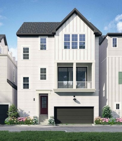 view of front of home featuring a garage and a balcony