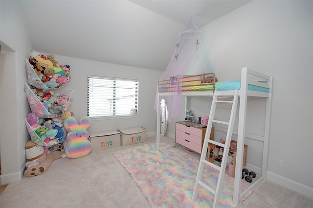 bedroom featuring carpet flooring and vaulted ceiling