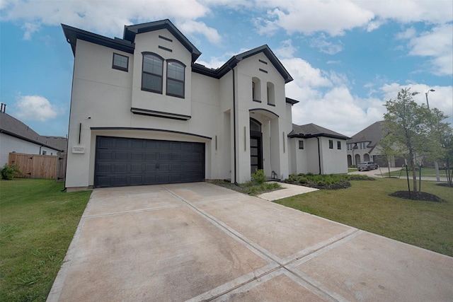 view of front of house with a garage and a front lawn