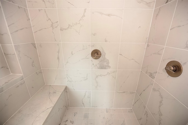 bathroom with a tile shower