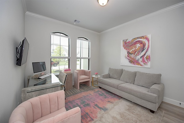 living room featuring hardwood / wood-style flooring and ornamental molding