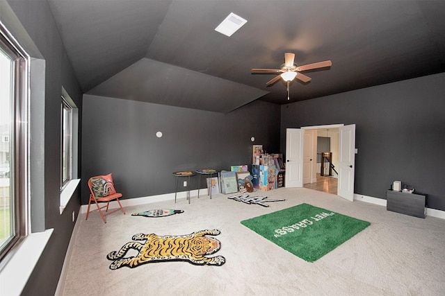 game room with ceiling fan, carpet floors, and vaulted ceiling