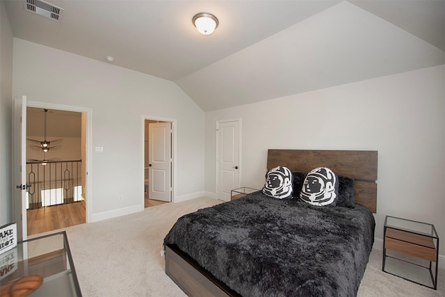 carpeted bedroom featuring vaulted ceiling