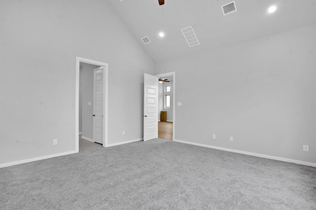 unfurnished bedroom featuring carpet flooring, ceiling fan, and high vaulted ceiling