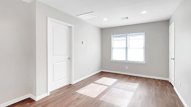 empty room featuring hardwood / wood-style flooring