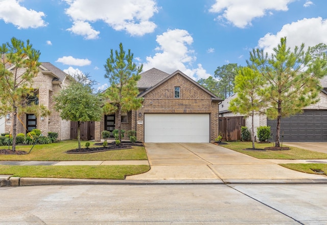 view of front of home featuring a front yard and a garage