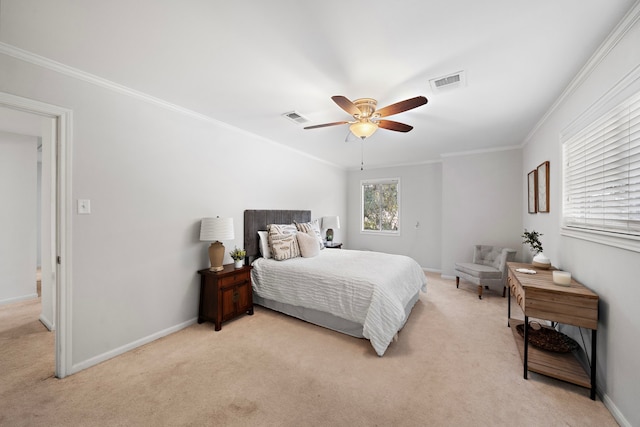 carpeted bedroom featuring ceiling fan and crown molding