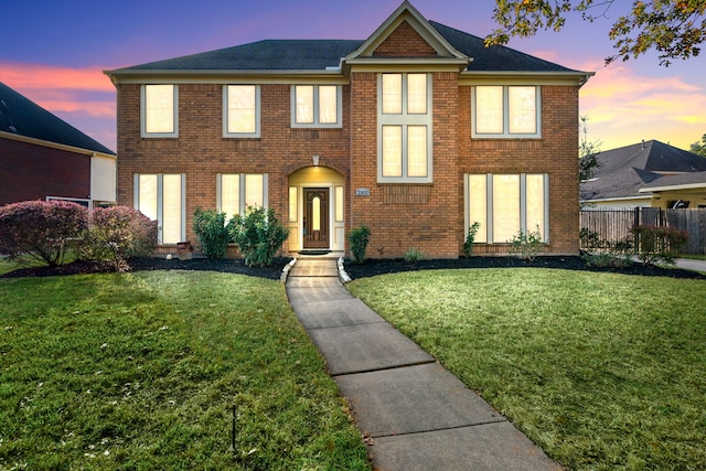 view of front of house featuring a lawn