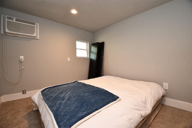 carpeted bedroom with a wall mounted air conditioner