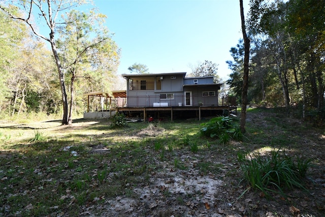 rear view of property with a wooden deck