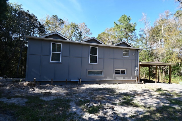 view of side of property with a carport