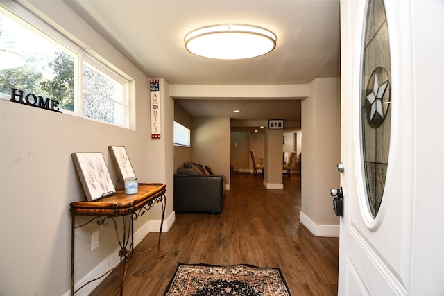 corridor with wood-type flooring