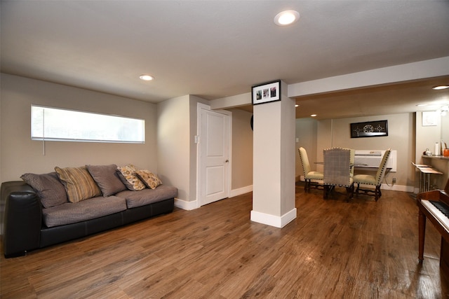 living room with dark wood-type flooring