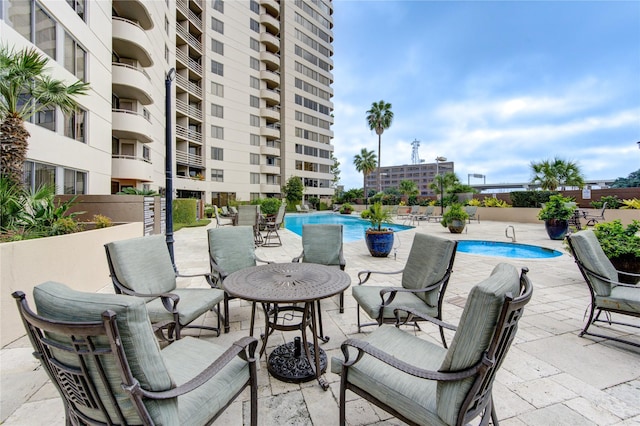 view of swimming pool featuring a patio area